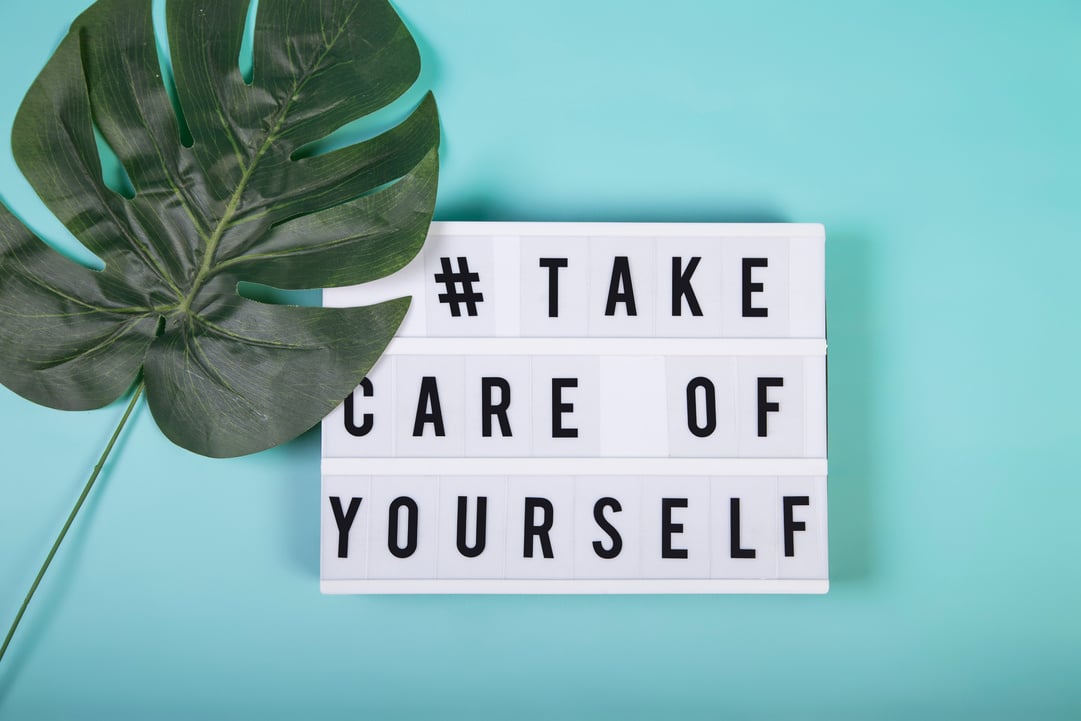 Lightbox with motivational words for self-care, mental health, emotional well-being. Top view.